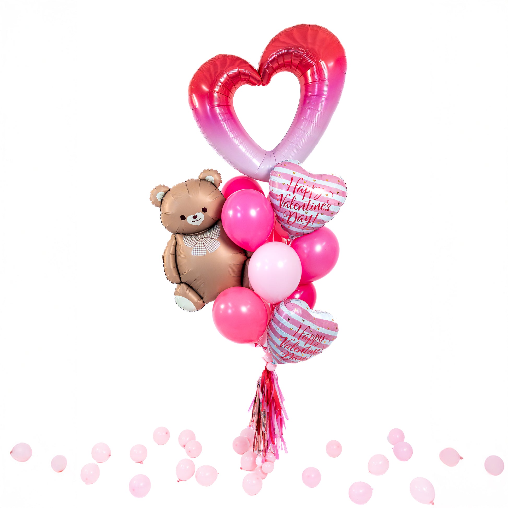 Valentines balloons in Toronto with teddy bear supershape, heart supershape, and pink latex balloons.
