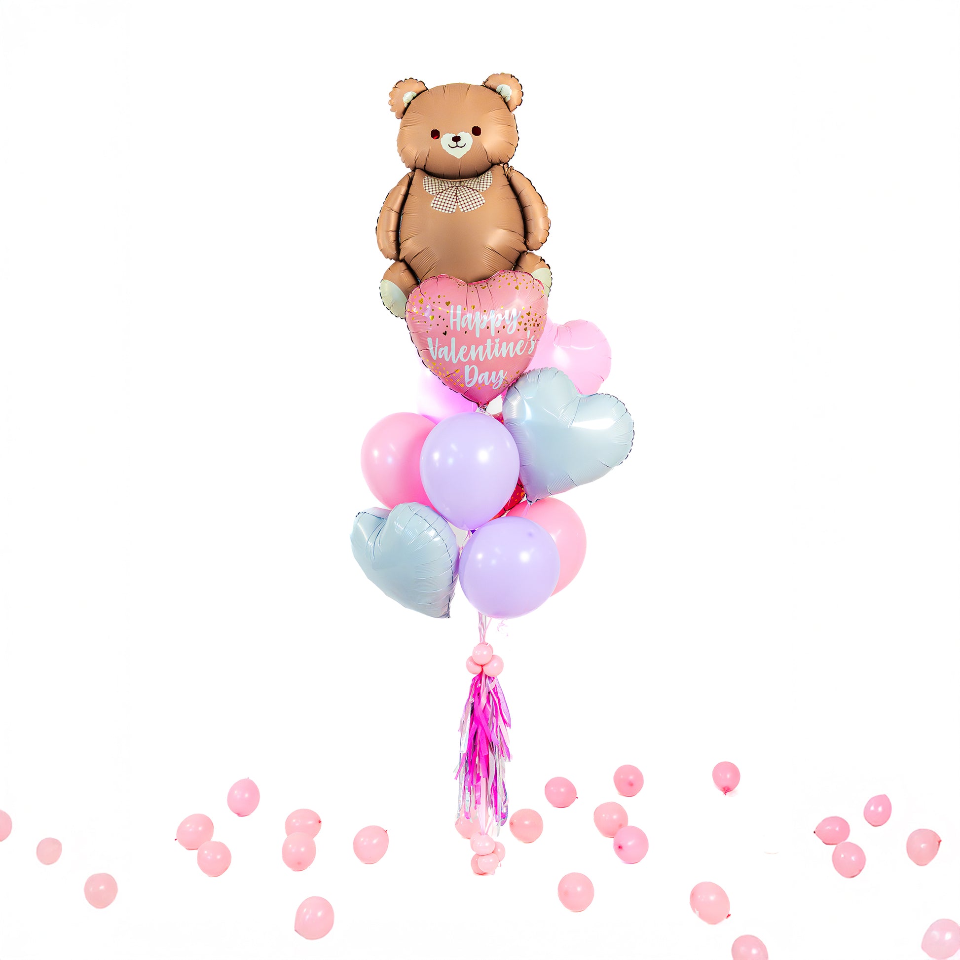 Valentines balloons in Toronto featuring a teddy bear balloon bouquet with pastel latex and heart foil balloons.
