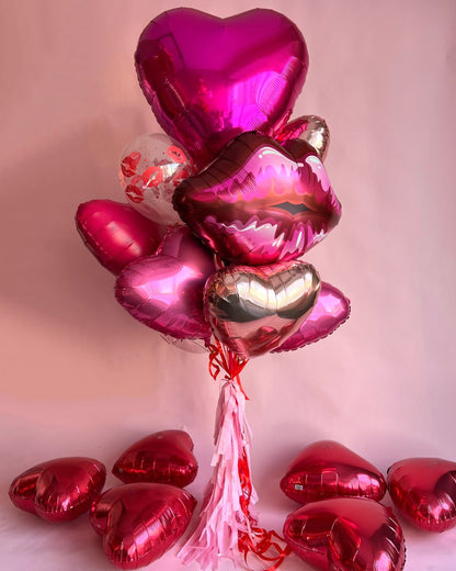 Valentine’s Day balloon bouquet Toronto with foil heart balloons and tassel ribbons