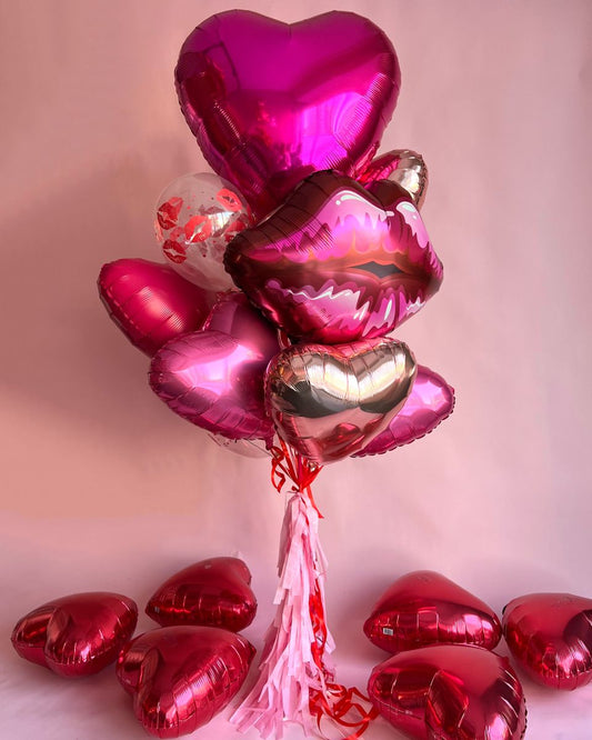 Valentine’s Day balloon bouquet Toronto with foil heart balloons and tassel ribbons