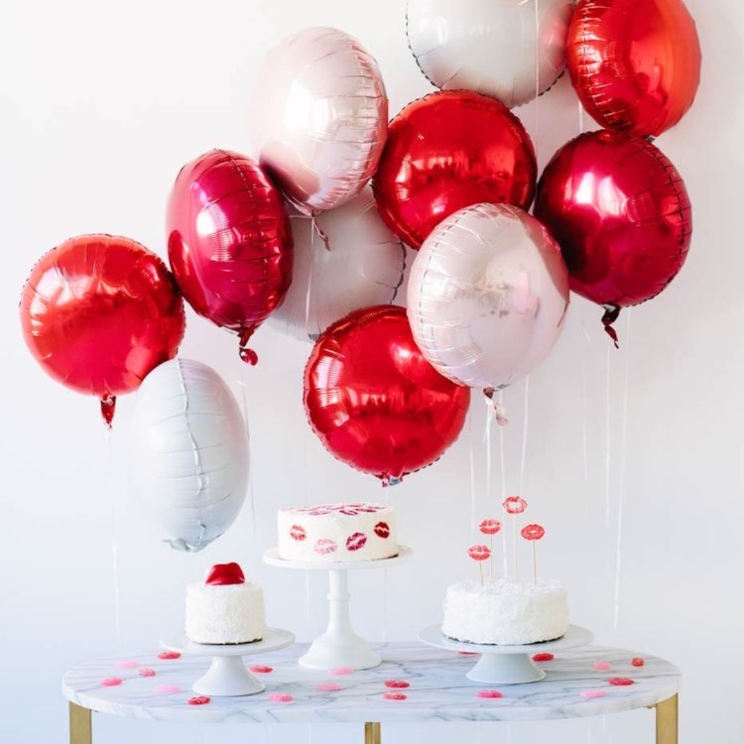 A colorful selection of 17" round foil balloons filled with helium